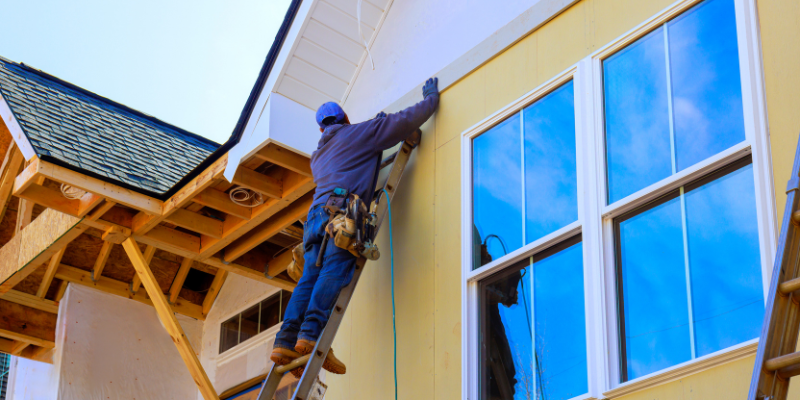 Construction worker on ladder